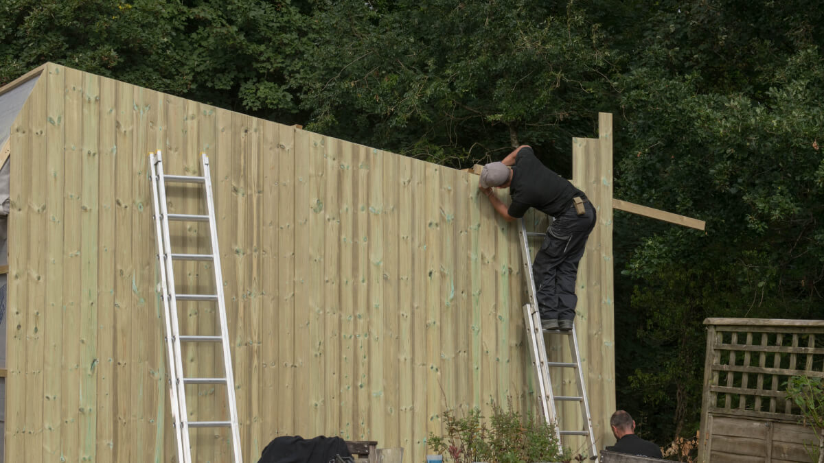 Man building with wood